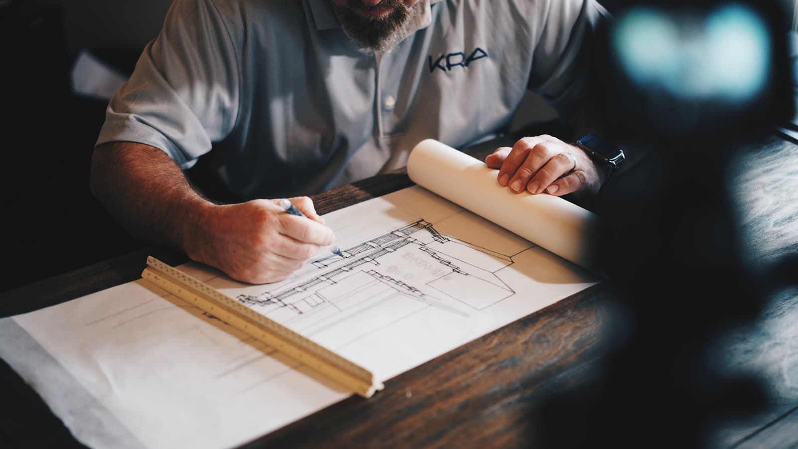 Ar. Sadik Qadri reviewing architectural drawings